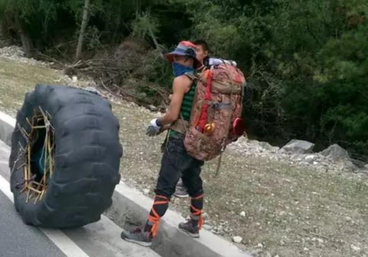 那些徒步去西藏旅遊的人，為啥還要滾一個輪胎？ 答案你絕對想不到